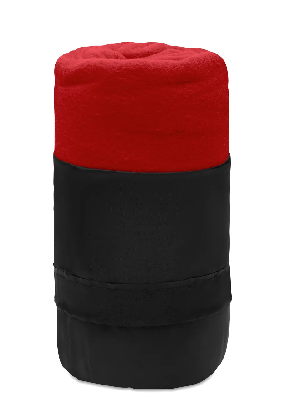 Red travel blanket rolled up in a black carry pouch, with the blanket showing at the top of the pouch.