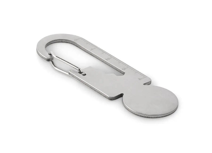 Hopeanvärinen MULTIKEY-ostoskärrypoletti, jossa karabiinihaka, viivain ja pullonavaaja.