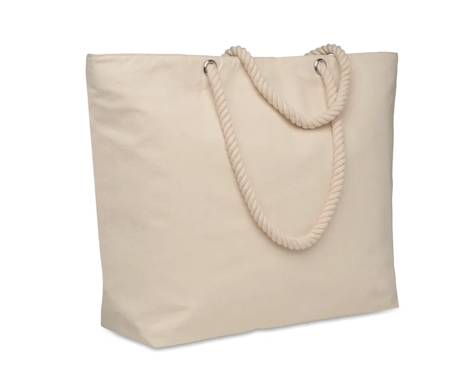 Beige puuvillainen kylmälaukku, jossa punotut narukahvat.