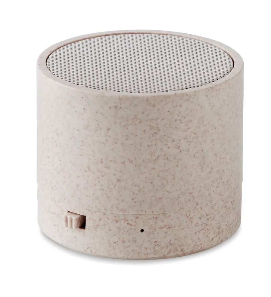 Beige sylinterinmuotoinen ROUND BASS+ Bluetooth-kaiutin, yläpinnassa rei'itetty kaiutinsäleikkö.