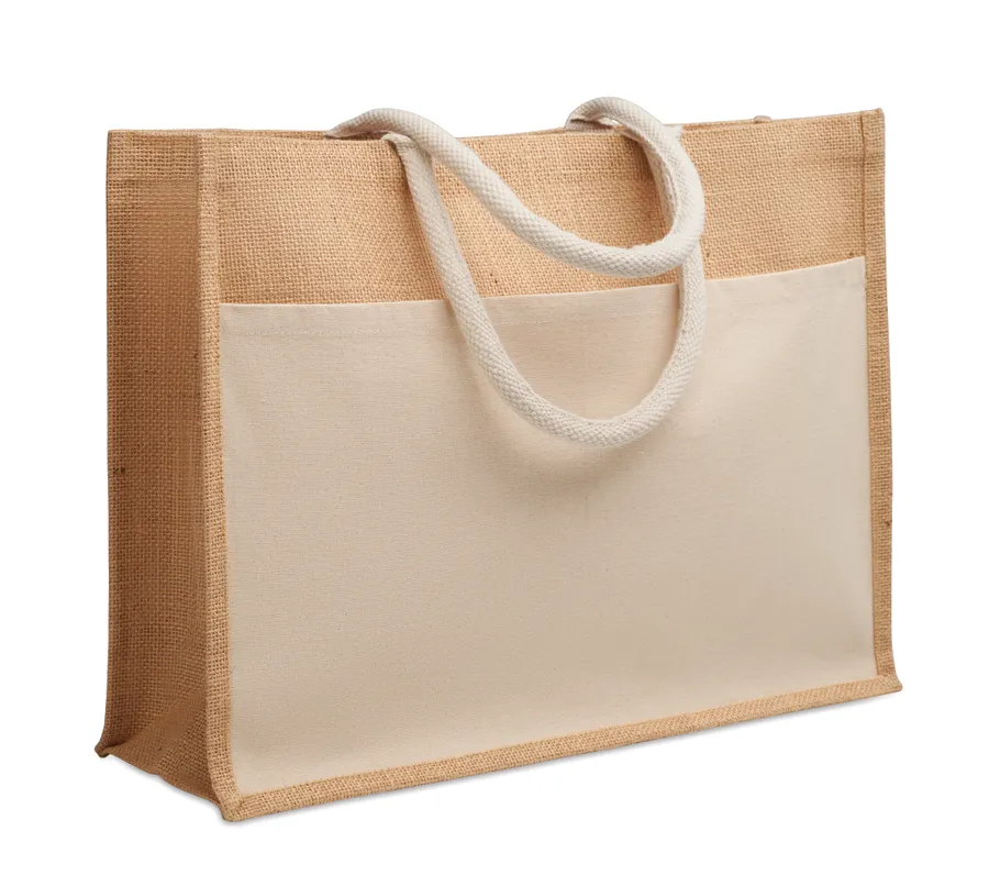Beige juutti- ja puuvillakankainen ostoskassi, jossa vaalea etutasku ja nyörikahvat.