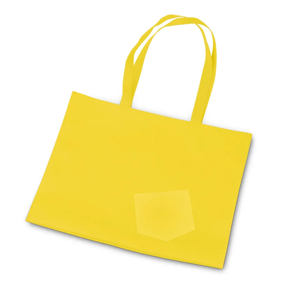 Keltainen kuitukangasostoskassi, jossa on pitkät kantokahvat ja pieni etutasku.