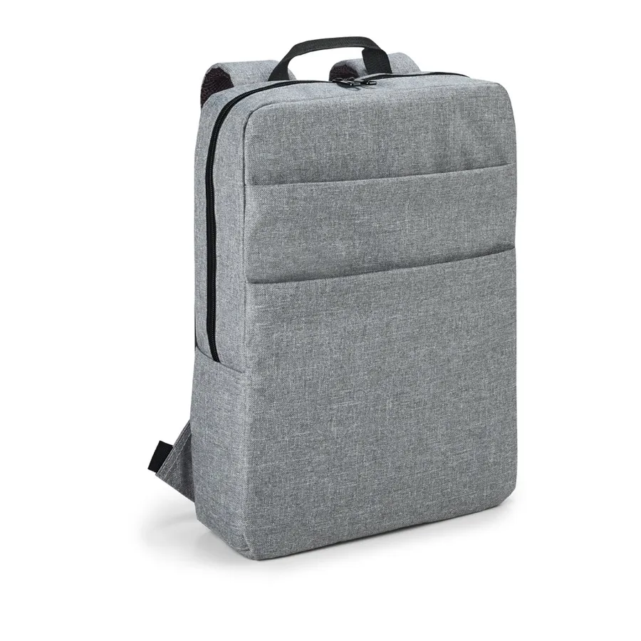 Vaaleanharmaa tietokonereppu, jossa vetoketjullinen etutasku ja kantokahva.