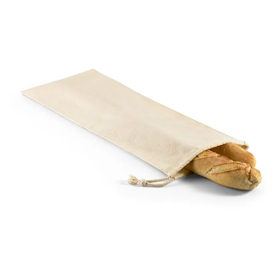 Vaalea puuvillainen leipäpussi kiristysnyörillä, sisällä patonki.