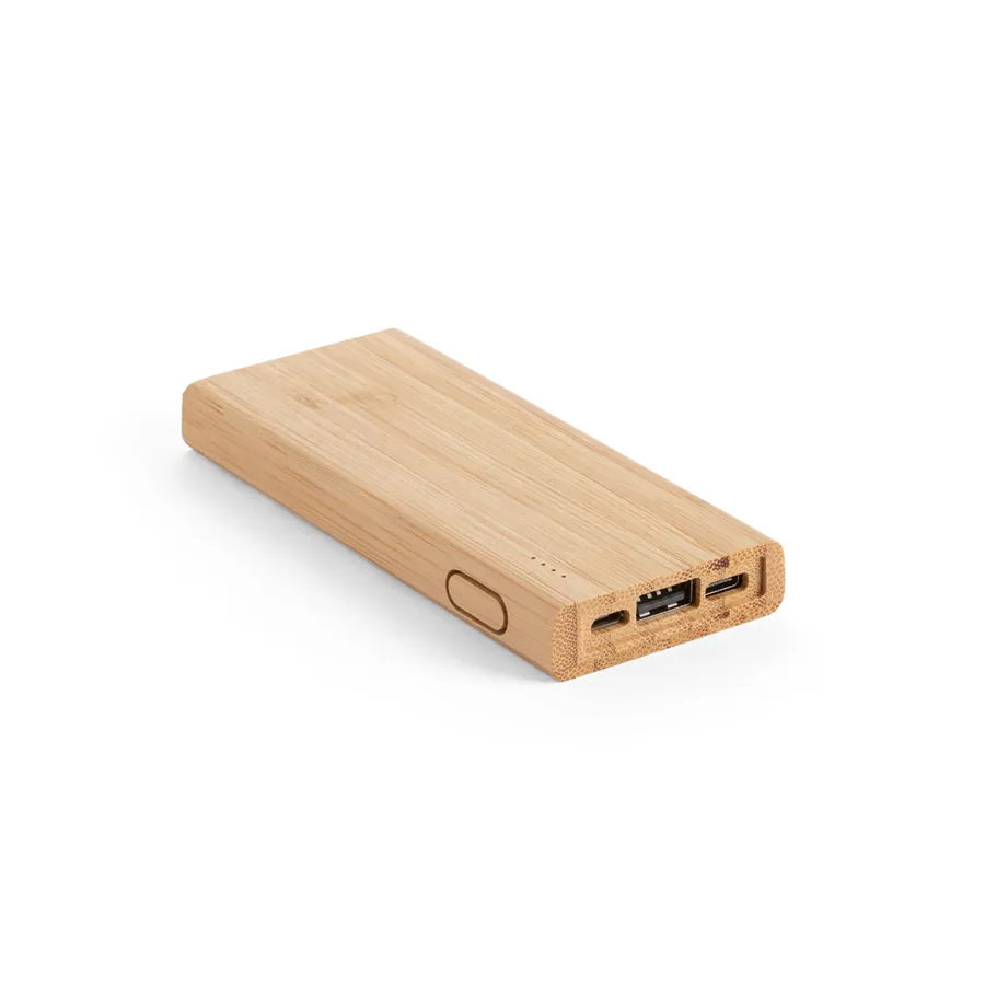 Bambusta valmistettu suorakaiteen muotoinen varavirtalähde, jossa USB-liitännät ja painike sivussa.