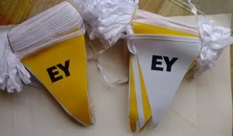 Yellow and white triangular pennant strings with black EY print.