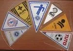 Six triangular pennants in different colours, each with its own logo print.
