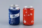 Blue and red can cooler with a white floral pattern and Oxygen logo print.